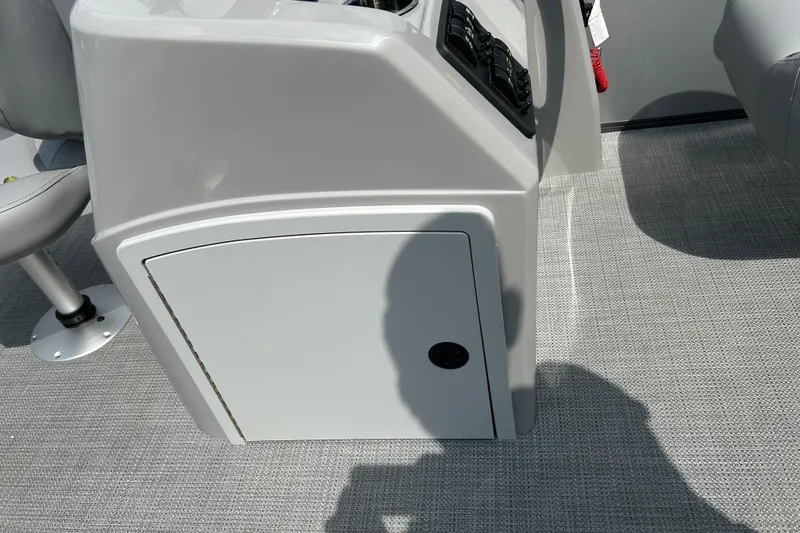 Slide: The Image of 2025 Bentley Pontoons LE 180 3PT console with storage compartment and control panel. - 19