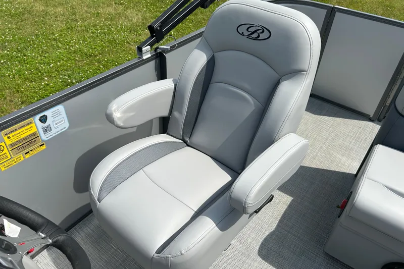 Slide: The Image of 2025 Bentley Pontoons LE 180 3PT captain's chair with elegant gray upholstery. - 23