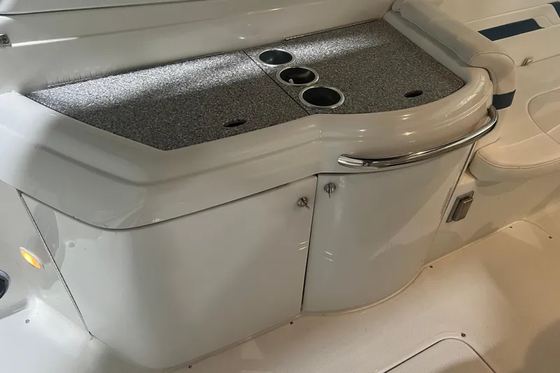 Slide: The Image of 2005 Formula 330 Sun Sport boat interior with countertop and cup holders. - 11