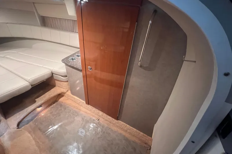 Slide: The Image of 2005 Formula 330 Sun Sport cabin interior with seating and wooden cabinetry. - 15
