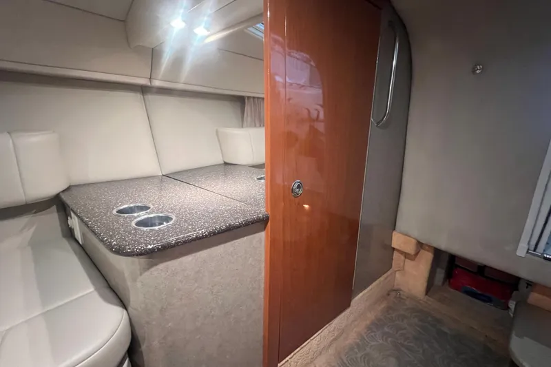 Slide: The Image of Interior of a 2005 Formula 330 Sun Sport boat with seating and wooden cabinetry. - 20