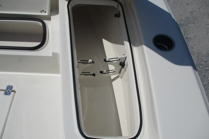 Slide: The Image of Storage compartment of 2026 Avenger AV26 boat, featuring sleek design and secure latches. - 12