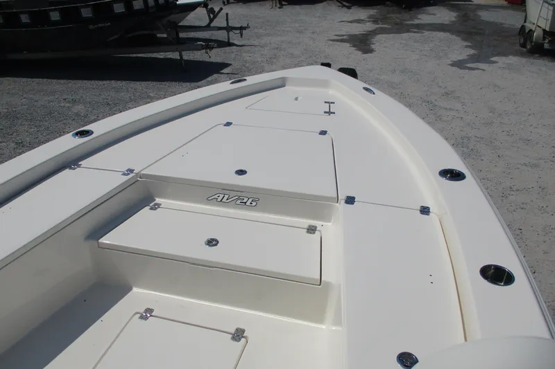 Slide: The Image of 2026 Avenger AV26 boat deck with storage compartments and sleek design. - 14