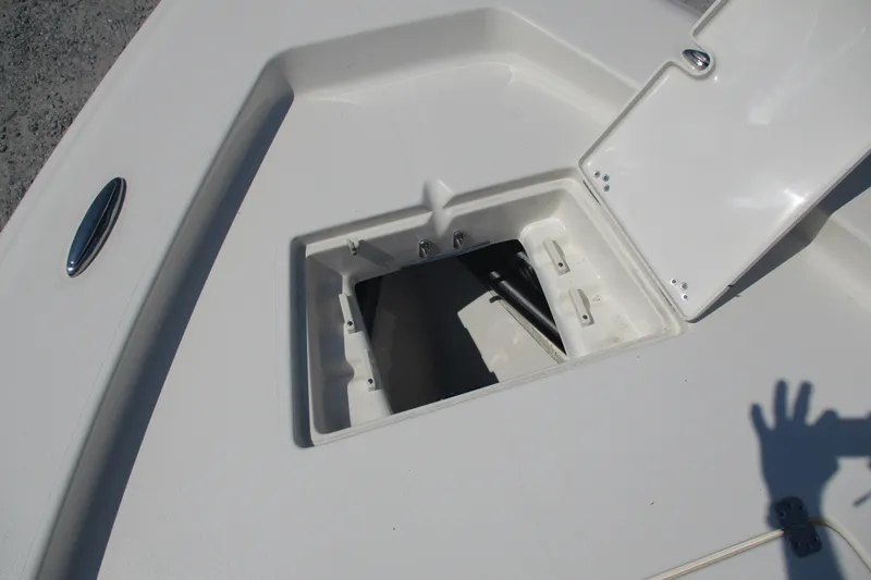 Slide: The Image of Open storage compartment on 2026 Avenger AV26 boat deck. - 15