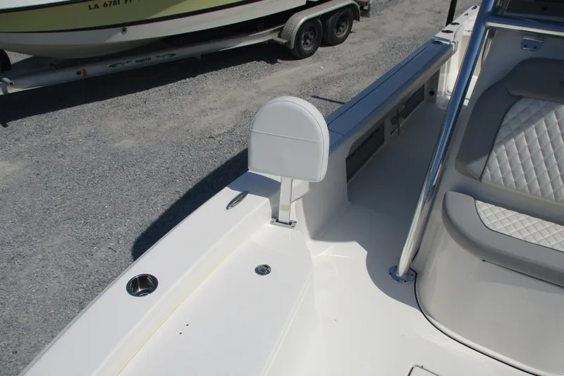 Slide: The Image of 2026 Avenger AV26 boat interior with white seating and stainless steel railing. - 16