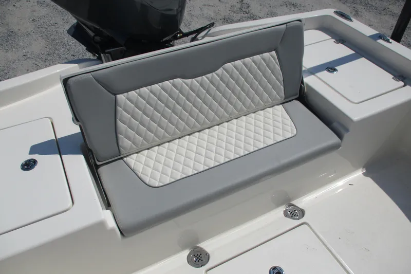 Slide: The Image of 2026 Avenger AV26 boat seat with quilted upholstery and storage compartments. - 17
