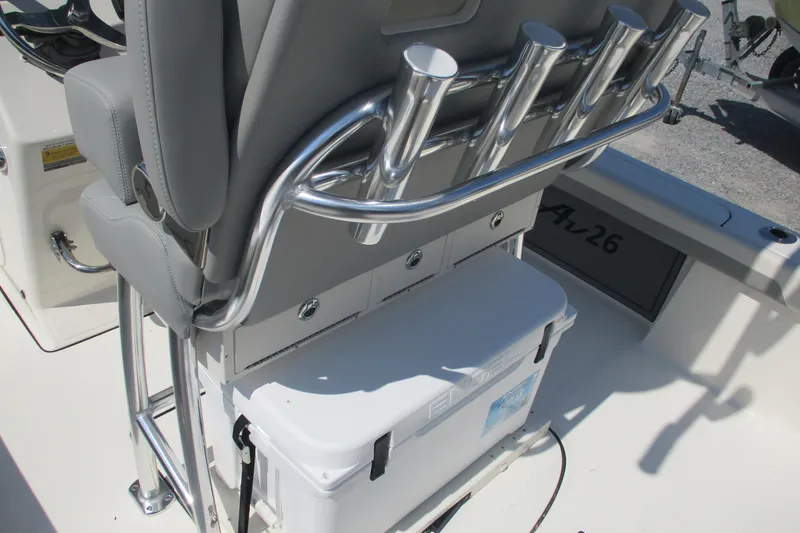 Slide: The Image of Avenger AV26 2026 boat interior with rod holders and storage compartment. - 18