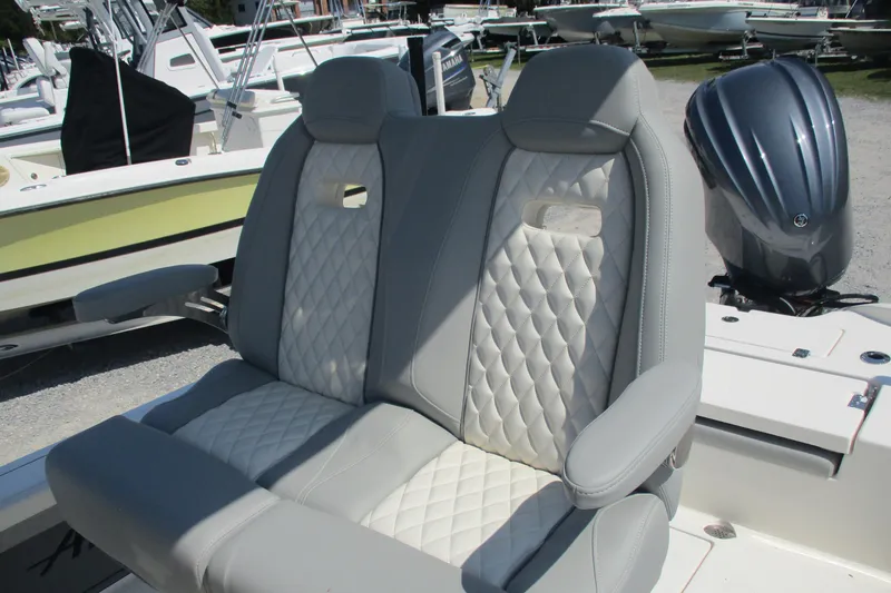 Slide: The Image of Luxury seating on 2026 Avenger AV26 boat with quilted upholstery and armrests. - 19