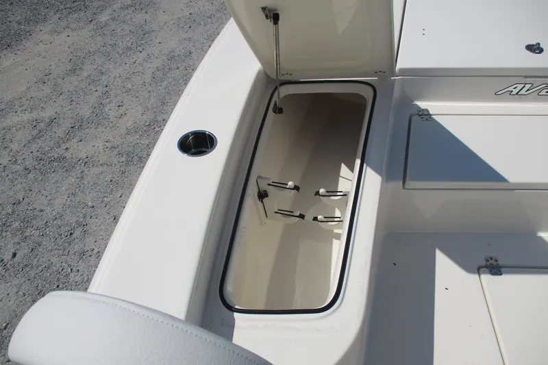 Slide: The Image of Open storage compartment on 2026 Avenger AV26 boat, featuring sleek white interior design. - 21