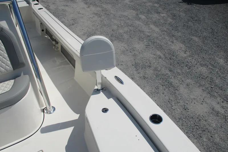 Slide: The Image of 2026 Avenger AV26 boat interior with seating and rod holder on deck. - 23