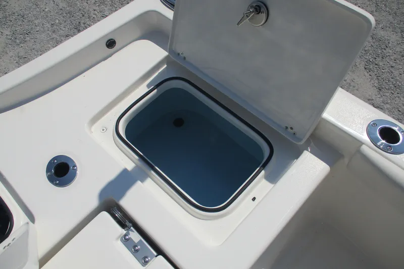 Slide: The Image of Open storage compartment on 2026 Avenger AV26 boat deck. - 9