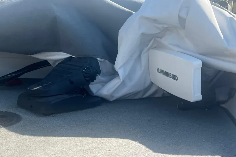 Slide: The Image of 2004 Ranger 618 VS boat with Humminbird equipment, partially covered. - 4