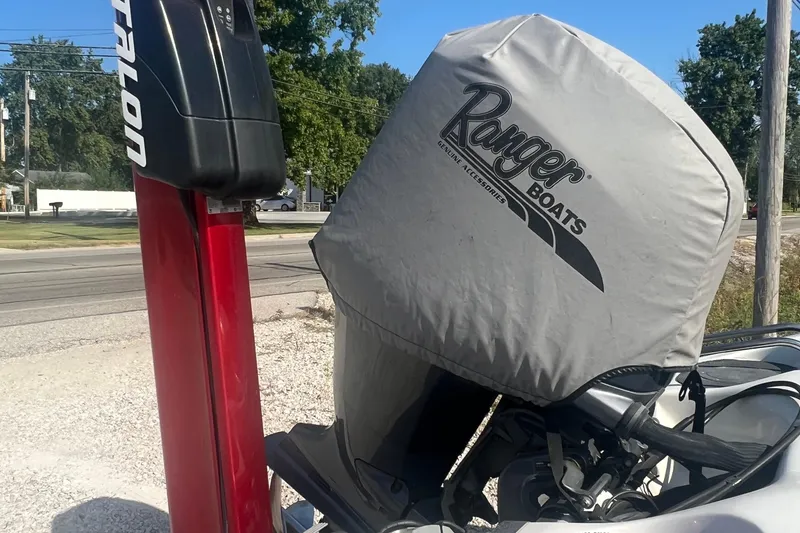 Slide: The Image of 2004 Ranger 618 VS boat engine with protective cover and red motor mount. - 8