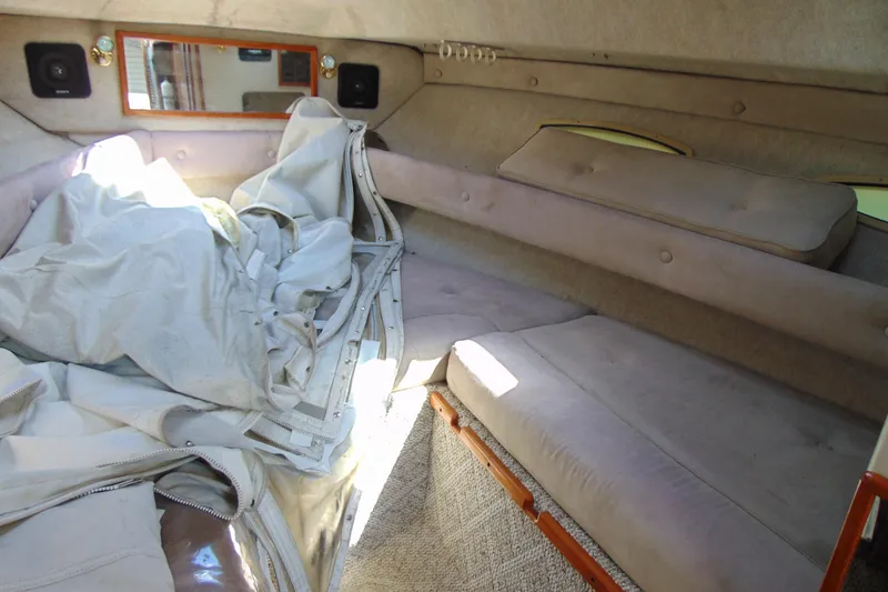 Slide: The Image of Interior cabin of 1988 Sea Ray 270 Amberjack with cushions and fabric. - 11