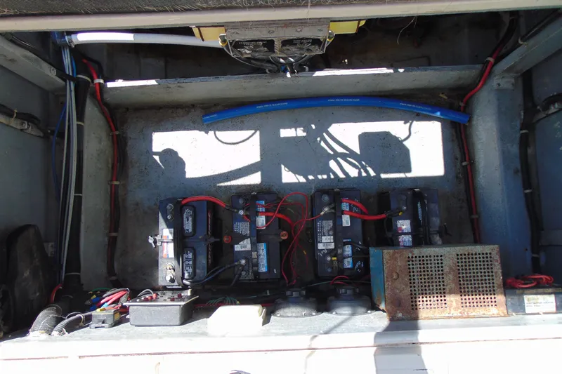Slide: The Image of 1988 Sea Ray 270 Amberjack engine compartment with batteries and wiring. - 19