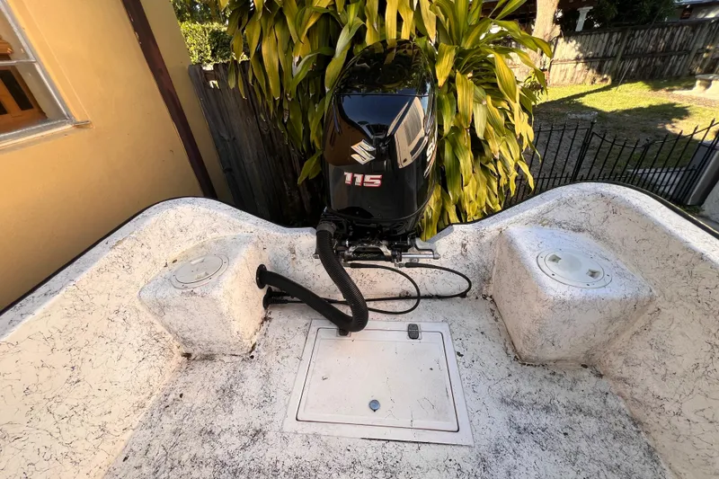 Slide: The Image of 2017 Panga Minsa boat with stainless steel rod holders and satellite dish, viewed from below. - 11