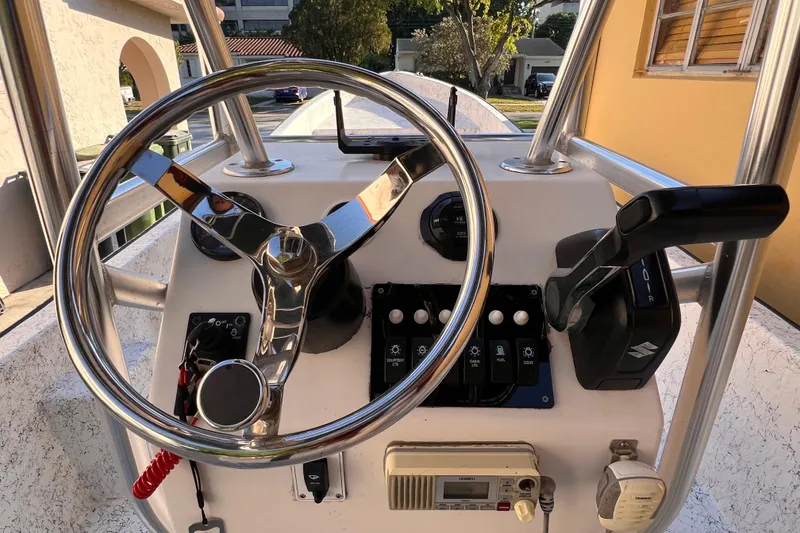 Slide: The Image of 2017 Panga Minsa boat with life preserver and radar, under clear blue sky. - 15