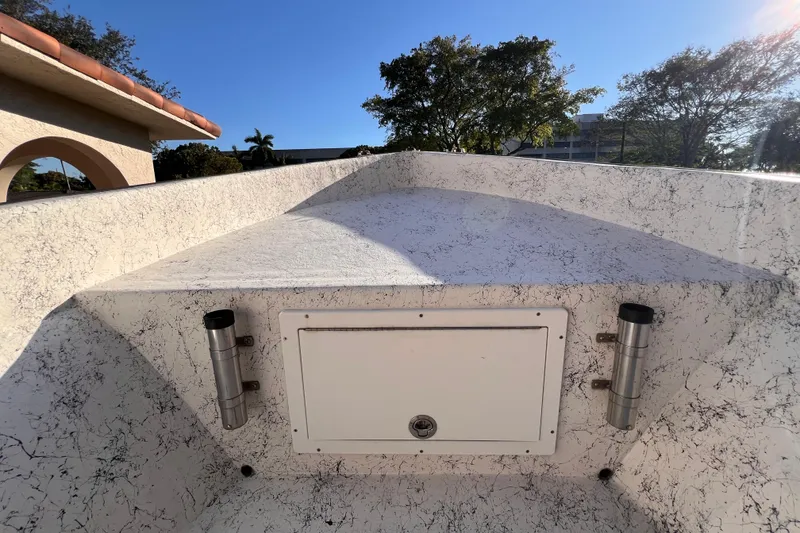 Slide: The Image of Storage compartment on 2017 Panga Minsa boat with life jackets and safety equipment. - 21