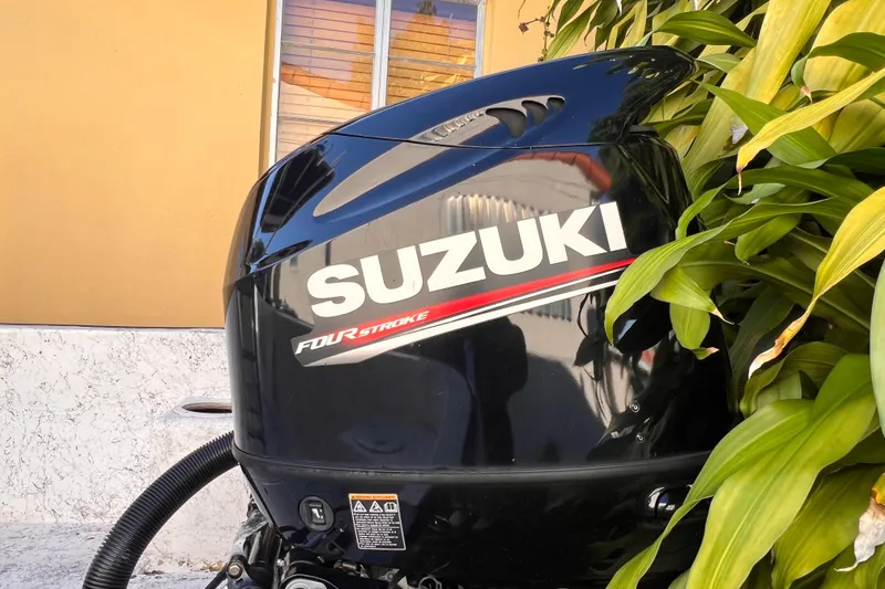 Slide: The Image of Label on Suzuki motor, model DF115A, made in Japan, attached to Panga Minsa 2017. - 8