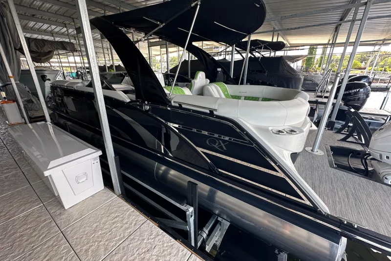 Slide: The Image of Simrad display on 2022 Bennington QX 25 Quad Bench showing speed, depth, and temperature. - 13