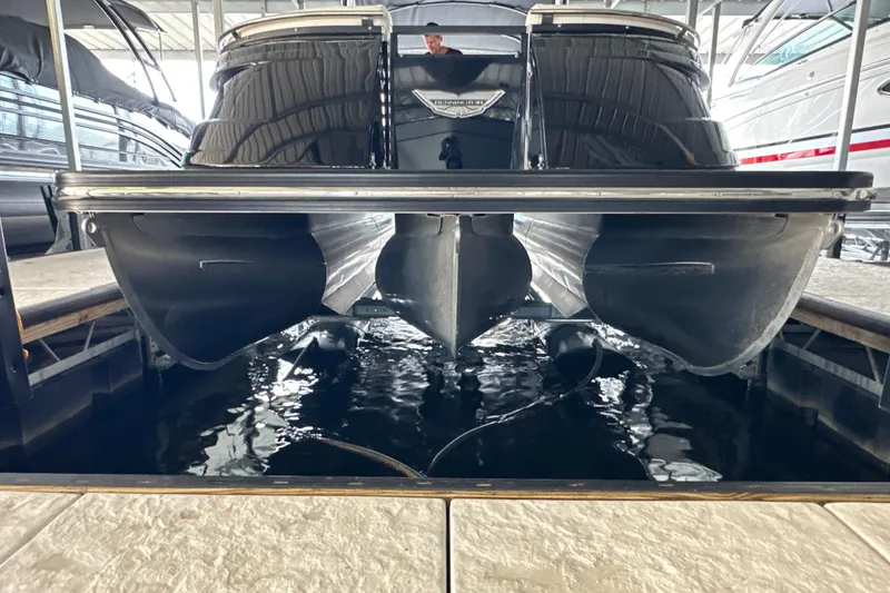 Slide: The Image of Simrad navigation display on Bennington QX 25 Quad Bench, showing detailed lake map and data. - 14