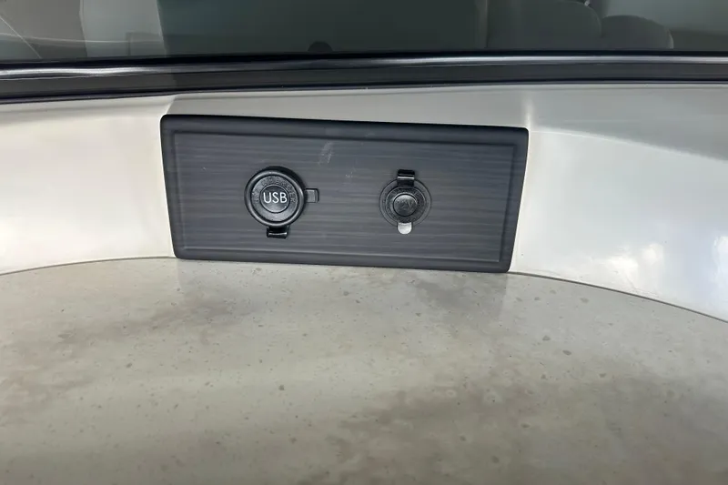 Slide: The Image of 2022 Bennington QX 25 Quad Bench interior with speaker and control panel. - 22