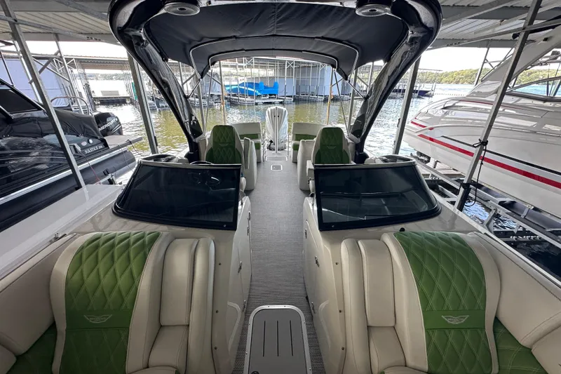 Slide: The Image of 2022 Bennington QX 25 Quad Bench interior with speaker and control panel. - 25