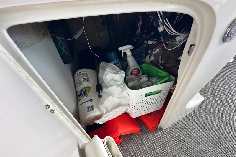 Slide: The Image of 2022 Bennington QX 25 Quad Bench pontoon boat underside in water. - 32