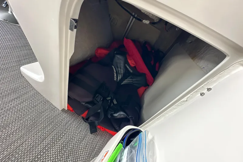 Slide: The Image of 2022 Bennington QX 25 Quad Bench with visible serial number plate and warning label. - 33