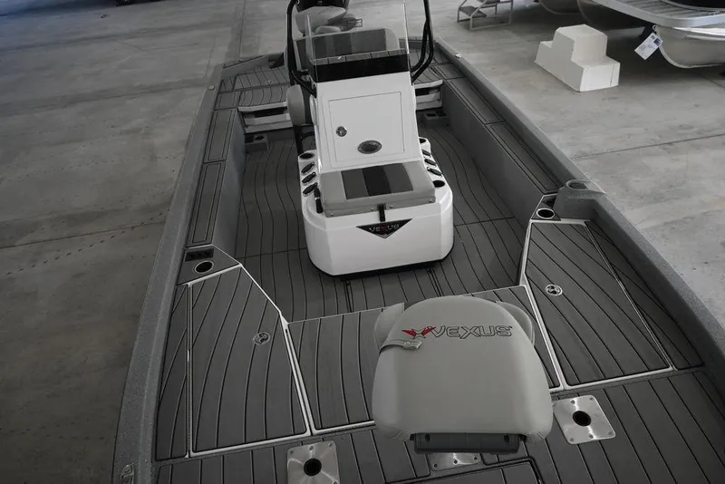 Slide: The Image of 2026 Vexus ACX 2210 boat interior with sleek gray deck and modern console design. - 15