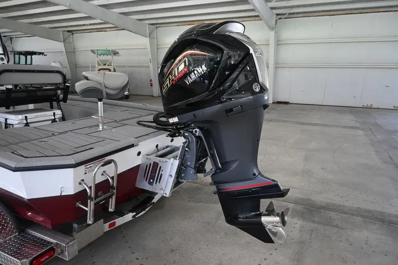Slide: The Image of 2026 Vexus ACX 2210 boat with Yamaha outboard motor in a garage setting. - 3