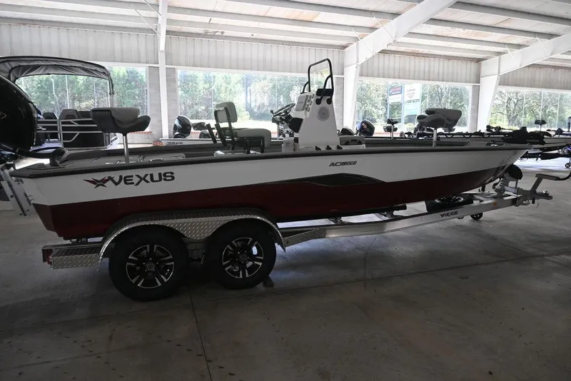 Slide: The Image of 2026 Vexus ACX 2210 boat on trailer in showroom, side view. - 6