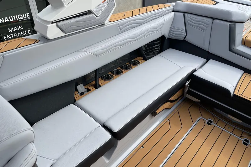 Slide: The Image of 2026 Nautique Super Air Nautique G25 interior with sleek seating and modern design. - 7