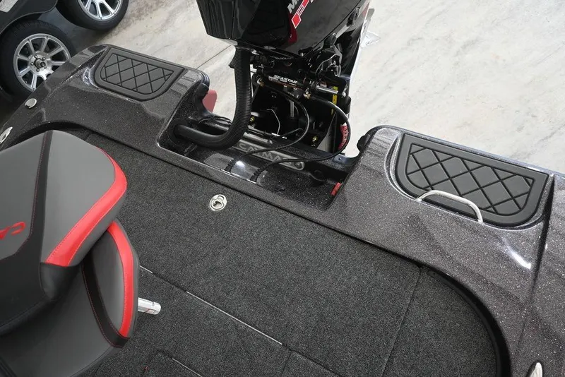 Slide: The Image of 2026 Caymas CX20 PRO boat interior with sleek seating and engine details. - 7