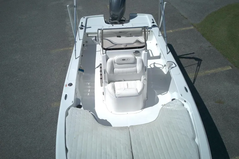 Slide: The Image of 2017 Sea Hunt BX 22 BR boat interior with white seating and console. - 11