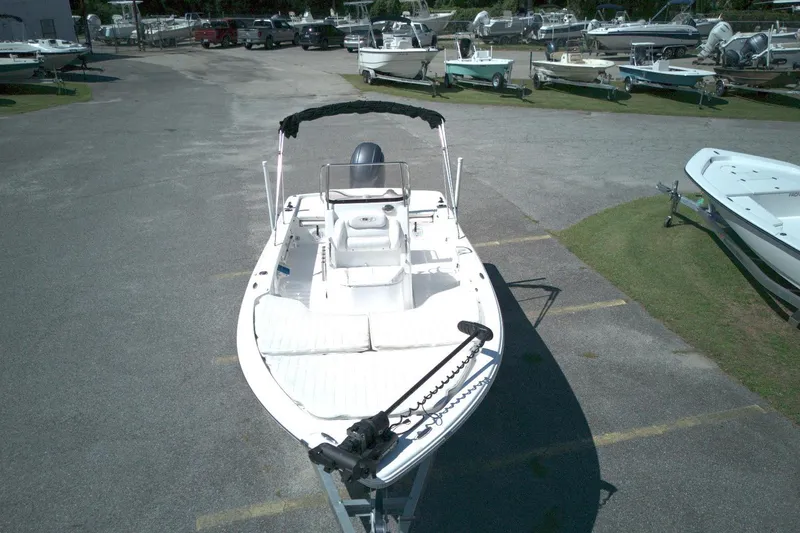 Slide: The Image of 2017 Sea Hunt BX 22 BR boat on trailer in a marina parking lot. - 12