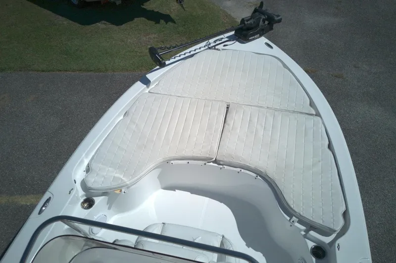 Slide: The Image of 2017 Sea Hunt BX 22 BR boat with cushioned bow seating and trolling motor. - 6