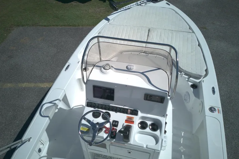 Slide: The Image of 2017 Sea Hunt BX 22 BR boat interior with steering console and seating area. - 7