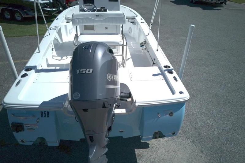 Slide: The Image of 2017 Sea Hunt BX 22 BR boat with Yamaha 150 engine, parked on pavement. - 9