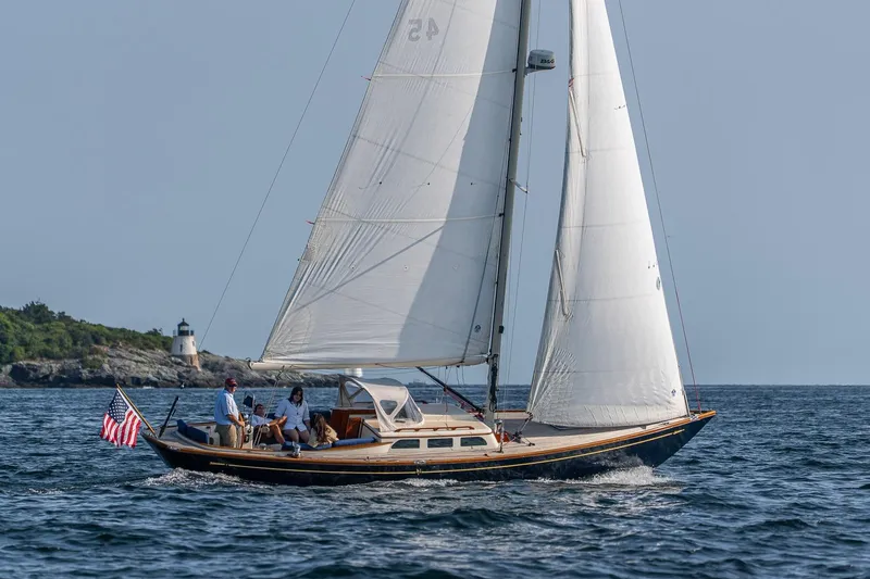 Slide: The Image of 2008 Morris Yachts M36 sailing near a lighthouse on a clear day. - 3