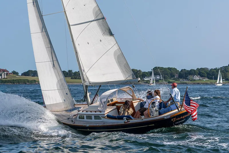 Slide: The Image of 2008 Morris Yachts M36 sailing with American flag on a sunny day. - 5