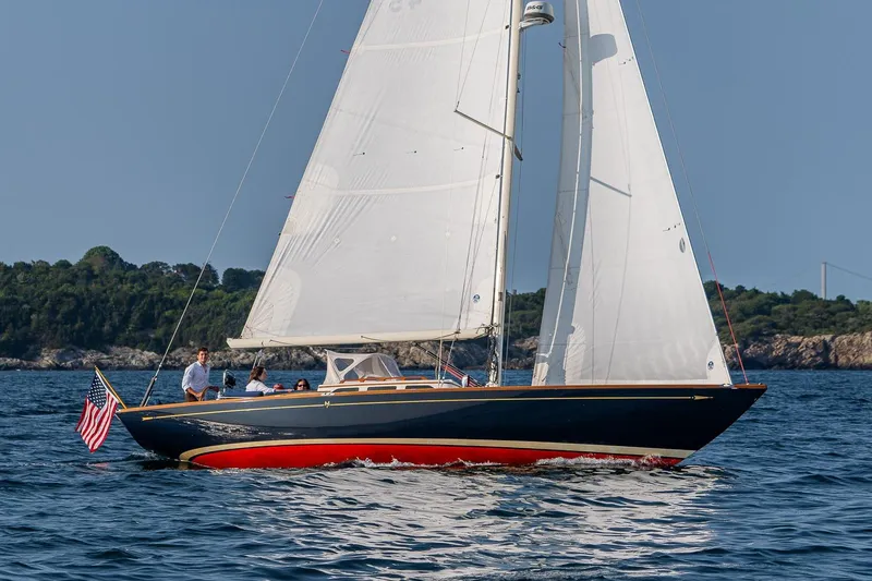 Slide: The Image of 2008 Morris Yachts M36 sailing on open water with American flag. - 7