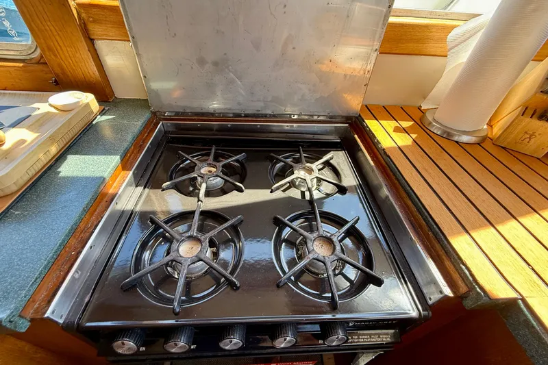 Slide: The Image of Gas stove in 1991 Kong & Halvorsen Island Gypsy yacht kitchen, with wooden countertops. - 11
