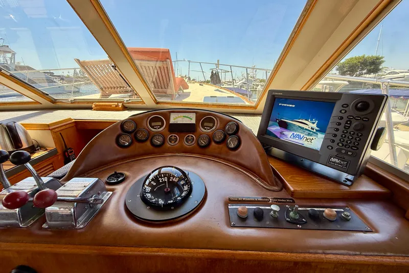 Slide: The Image of 1991 Kong & Halvorsen Island Gypsy helm with navigation equipment and controls. - 13