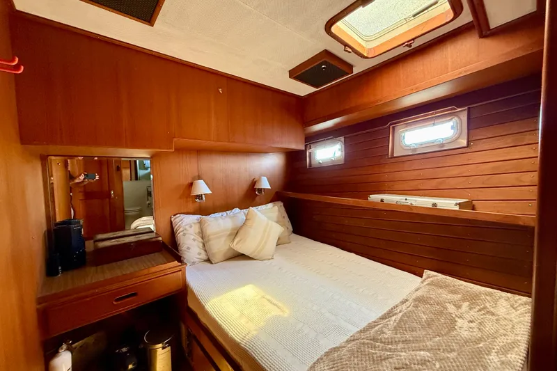 Slide: The Image of Cozy 1991 Kong & Halvorsen Island Gypsy cabin with wood paneling and natural light. - 16