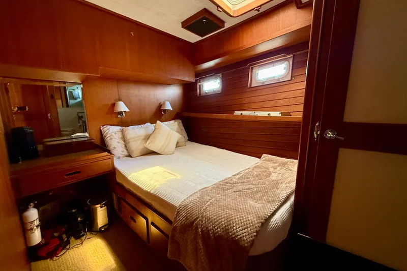 Slide: The Image of Cozy cabin interior of 1991 Kong & Halvorsen Island Gypsy yacht with wooden paneling. - 18