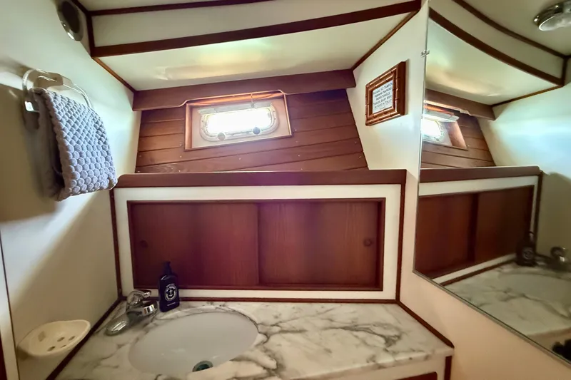 Slide: The Image of Bathroom interior of 1991 Kong & Halvorsen Island Gypsy yacht with marble countertop. - 21