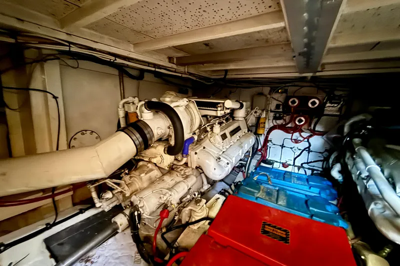 Slide: The Image of Engine room of a 1991 Kong & Halvorsen Island Gypsy yacht, showcasing machinery and components. - 27