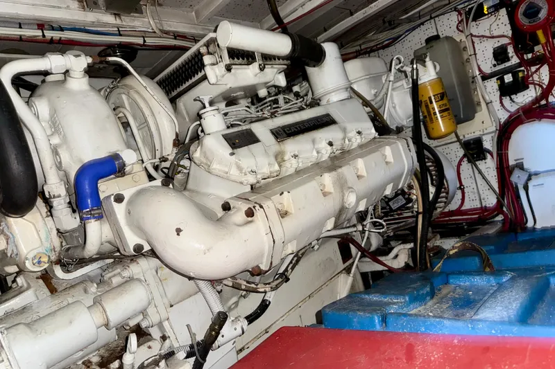 Slide: The Image of Engine room of a 1991 Kong & Halvorsen Island Gypsy boat, featuring a Caterpillar engine. - 33