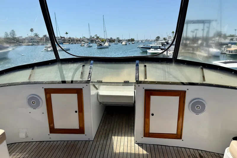 Slide: The Image of 1991 Kong & Halvorsen Island Gypsy boat interior with harbor view, featuring wooden accents. - 40